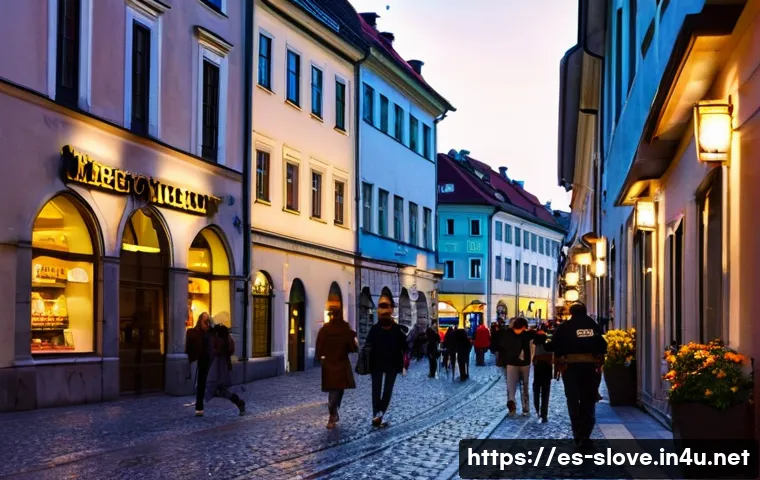 슬로베니아 지역별 치안 수준 - A lively urban street scene in Ljubljana&rsquo;s historic center at dusk, featuring well-lit cobblestone s...